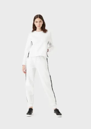 Pantaloni jogger in double jersey con tape logo e zip laterale